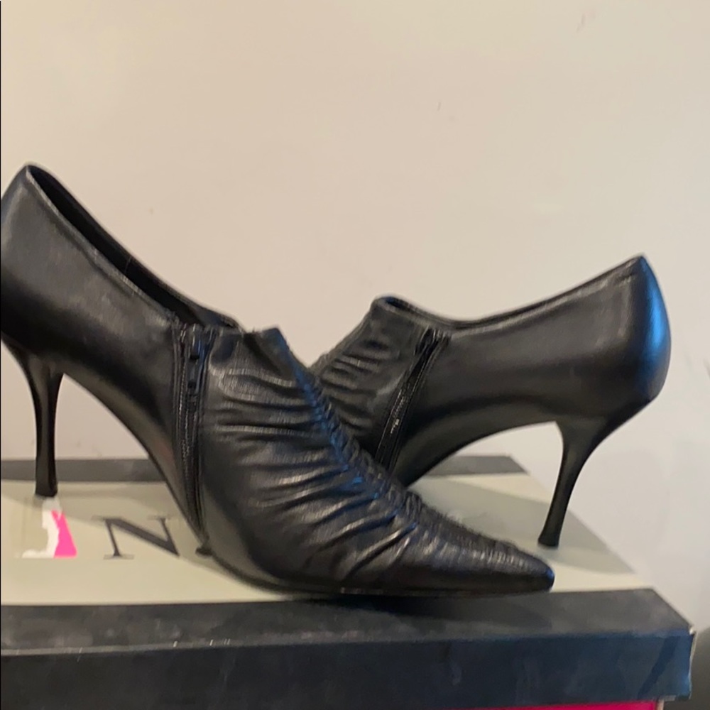 Black heel shoe. Never been worn. Leather upper.